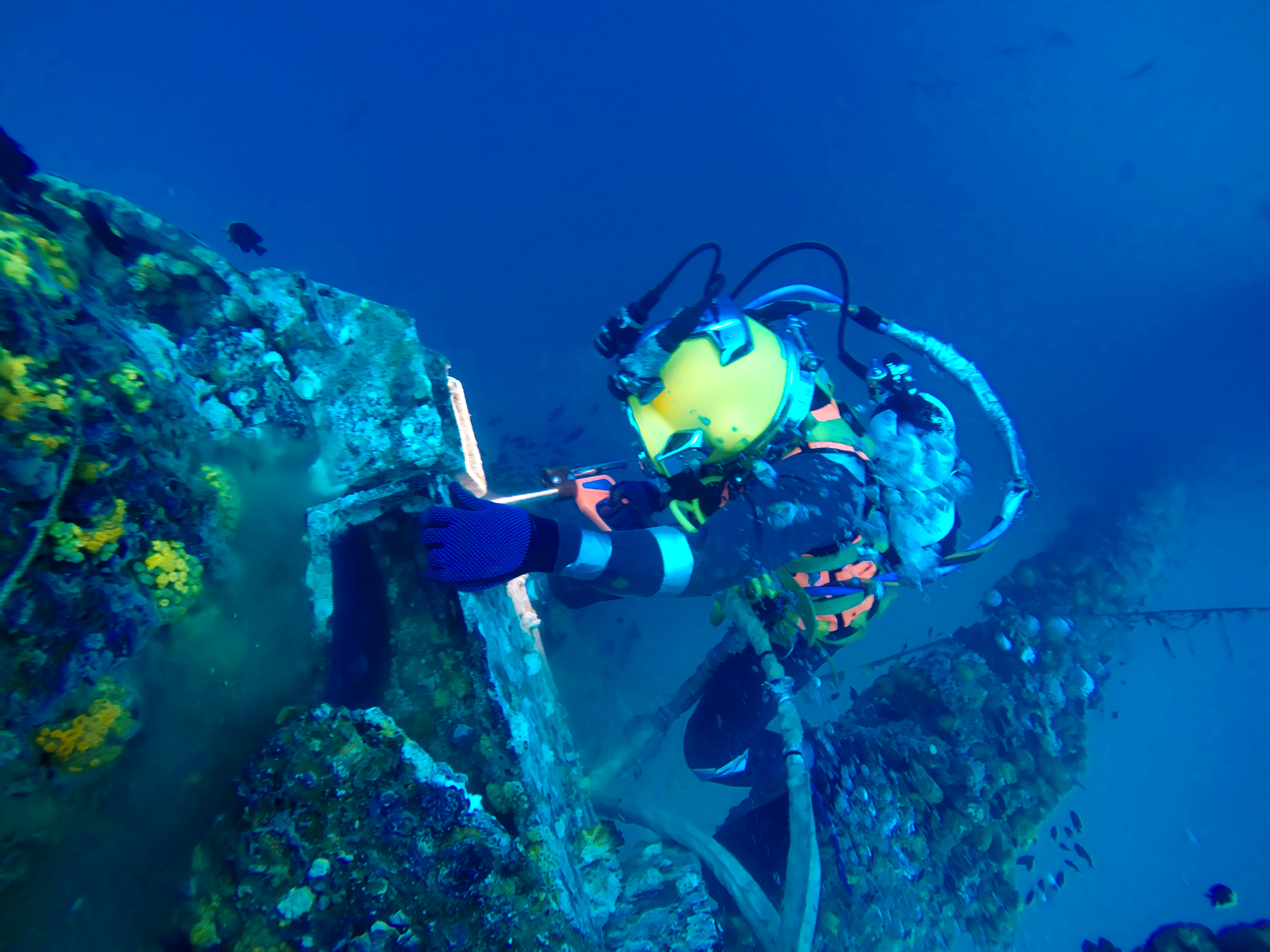 Commercial diver performing underwater welding